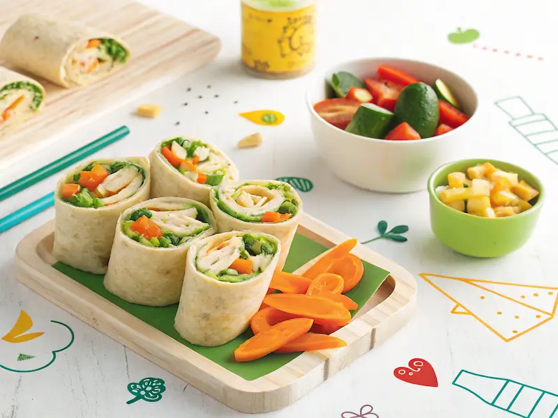 "Mini hummus and veggie wraps – a colorful, healthy lunch for kids, perfect for school."